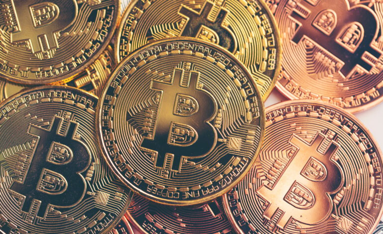 business success and money concept with bitcoins