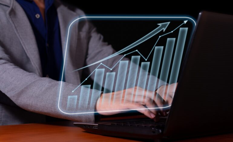 Entrepreneur analyzes economic and financial growth. Investment chart and economic trends.